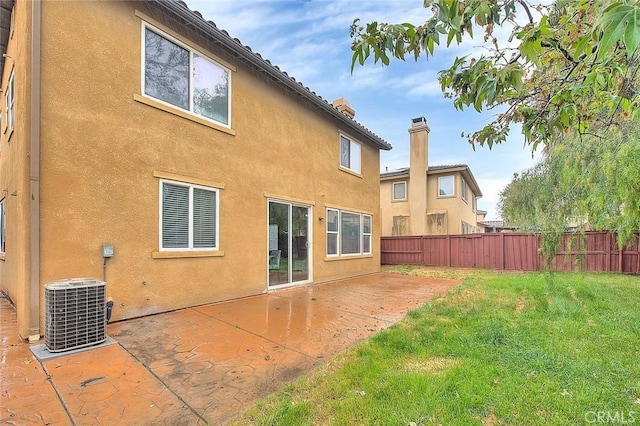 37089 Meadow Brook Way, Beaumont, CA 92223 - rear view of property with stucco siding, central AC, and a patio