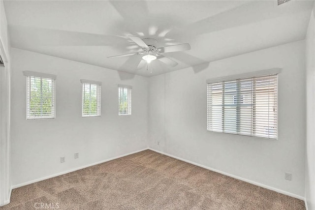 37089 Meadow Brook Way, Beaumont, CA 92223 - carpeted empty room featuring healthy amount of natural light, baseboards, and a ceiling fan