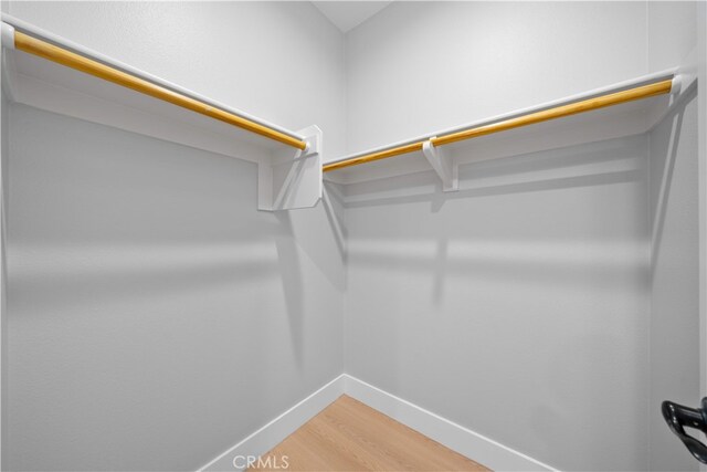 walk in closet featuring light wood-style floors