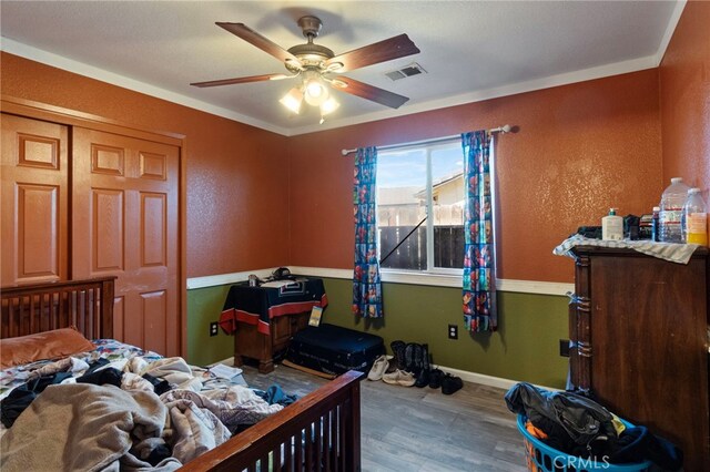 1451 Segovia Ct, Madera, CA 93638 - bedroom with wood finished floors, baseboards, a ceiling fan, and a closet