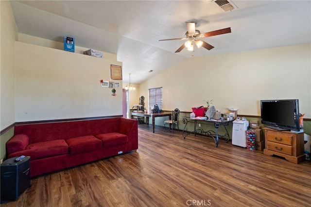 1451 Segovia Ct, Madera, CA 93638 - living area featuring wood finished floors, vaulted ceiling, a ceiling fan, and a chandelier