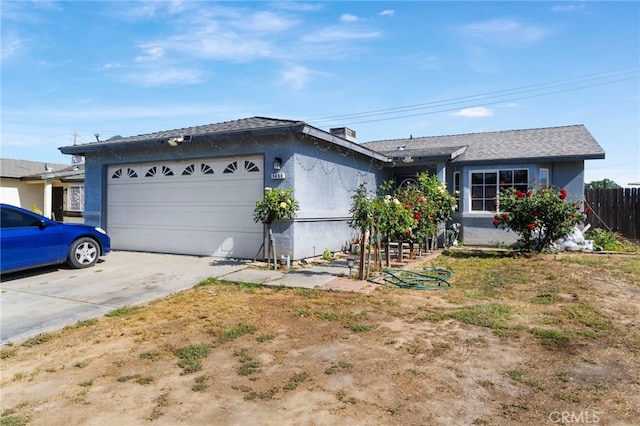 1451 Segovia Ct, Madera, CA 93638 - ranch-style home featuring an attached garage, concrete driveway, stucco siding, and fence