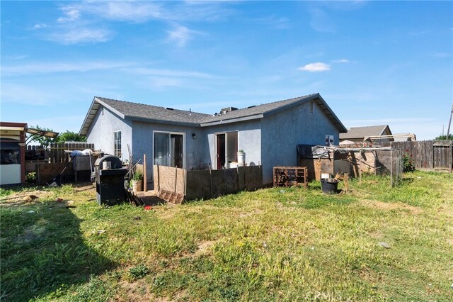 1451 Segovia Ct, Madera, CA 93638 - rear view of property featuring stucco siding