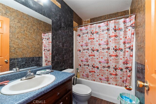 1451 Segovia Ct, Madera, CA 93638 - full bathroom with shower / bath combination with curtain, toilet, vanity, wood finished floors, and tile walls