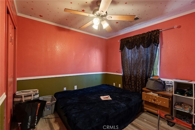 1451 Segovia Ct, Madera, CA 93638 - bedroom with wood finished floors, ornamental molding, and ceiling fan