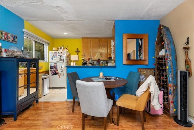 dining room featuring light wood-style flooring