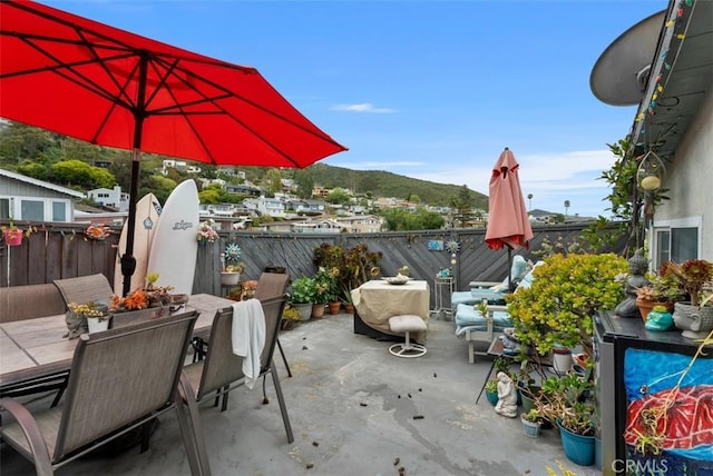 view of patio / terrace featuring outdoor dining area and fence