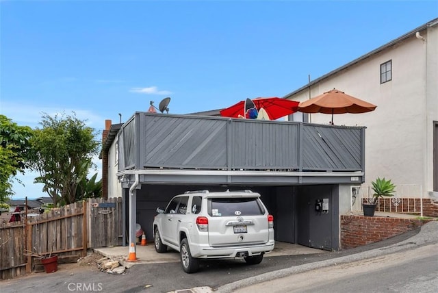 view of front of property with fence and stucco siding