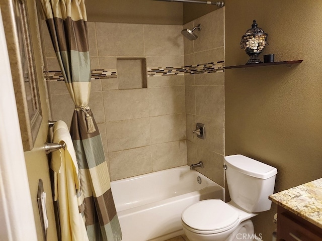bathroom featuring shower / tub combo, toilet, and vanity