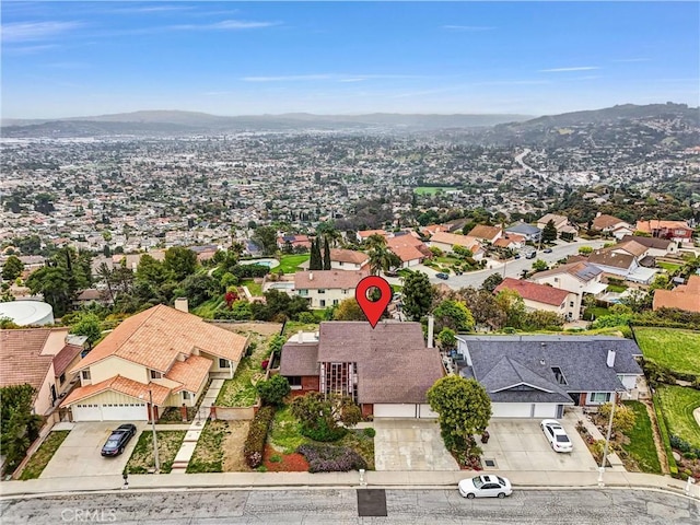 aerial perspective of suburban area featuring a mountainous background