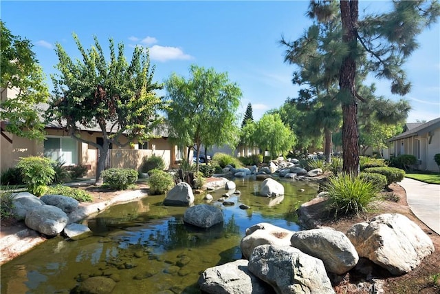 22951 Caminito Viento, Laguna Hills, CA 92653 - view of yard featuring a garden pond