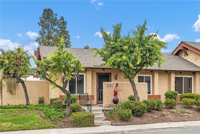 22951 Caminito Viento, Laguna Hills, CA 92653 - view of front of property with stucco siding, fence, and a shingled roof