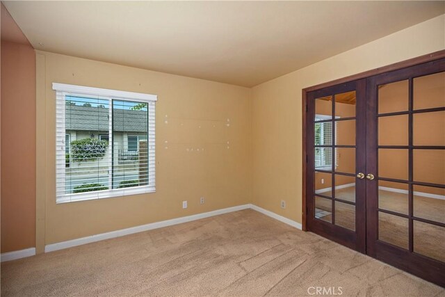 22951 Caminito Viento, Laguna Hills, CA 92653 - spare room featuring french doors, carpet, and baseboards