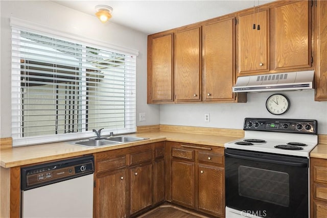 22951 Caminito Viento, Laguna Hills, CA 92653 - kitchen with electric stove, white dishwasher, under cabinet range hood, a sink, and brown cabinets