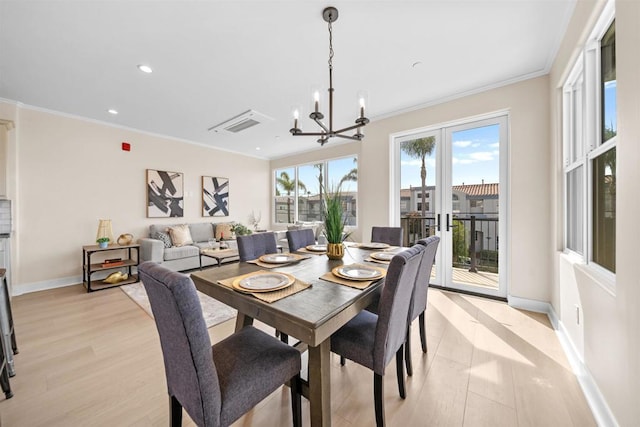 dining space with light wood-type flooring, a chandelier, ornamental molding, baseboards, and recessed lighting