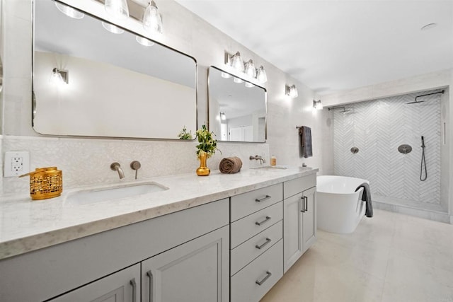 bathroom with a shower stall, a freestanding tub, double vanity, and backsplash