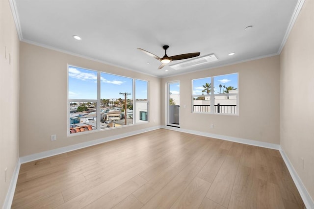 spare room with ornamental molding, wood finished floors, baseboards, a ceiling fan, and recessed lighting