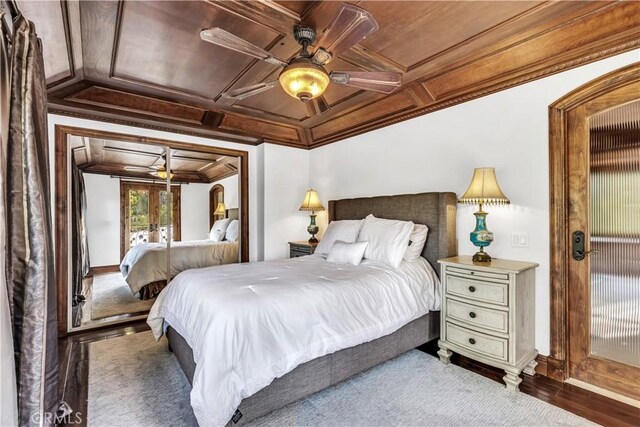 bedroom featuring coffered ceiling, crown molding, ceiling fan, and baseboards