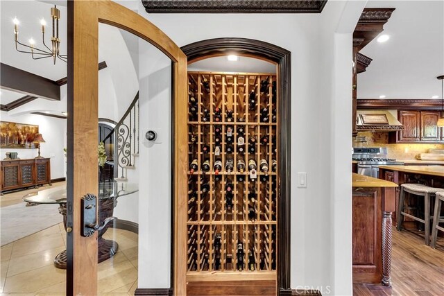 wine room with recessed lighting, baseboards, and tile patterned floors