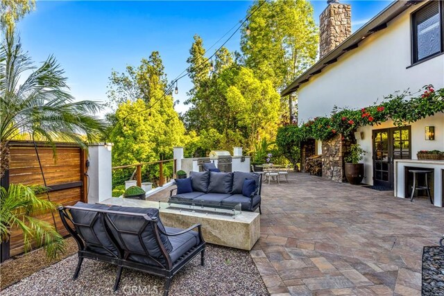 view of patio / terrace featuring area for grilling, an outdoor hangout area, outdoor dining area, french doors, and a grill