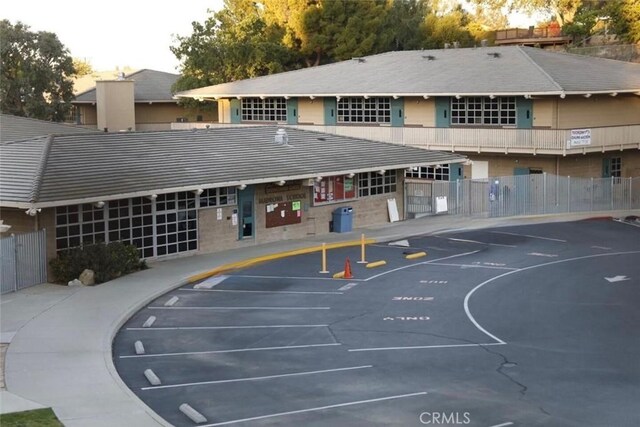 view of basketball court with fence