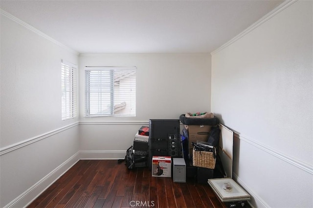 miscellaneous room featuring wood finished floors, crown molding, and baseboards