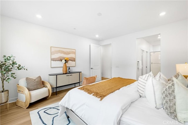 bedroom featuring light wood-style flooring and recessed lighting