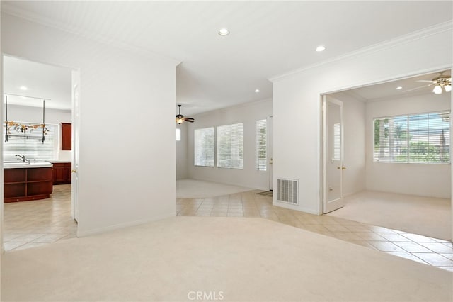 42133 Wagon Wheel Ln, Murrieta, CA 92562 - spare room with light tile patterned floors, light colored carpet, ceiling fan, ornamental molding, and recessed lighting