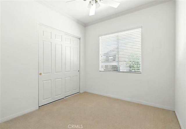 42133 Wagon Wheel Ln, Murrieta, CA 92562 - unfurnished bedroom featuring light colored carpet, crown molding, ceiling fan, and a closet