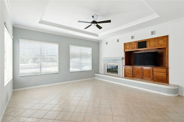 42133 Wagon Wheel Ln, Murrieta, CA 92562 - unfurnished living room featuring a raised ceiling, ceiling fan, healthy amount of natural light, and ornamental molding