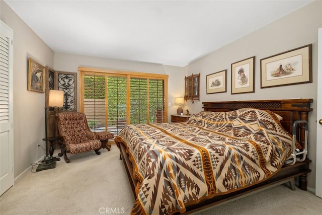 carpeted bedroom with baseboards