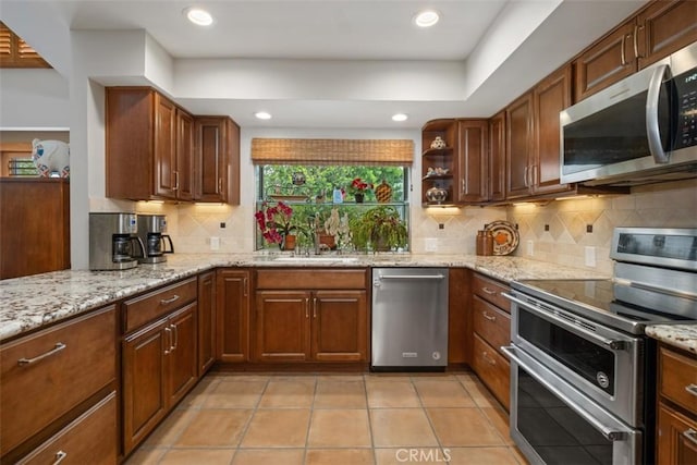 14321 Mimosa Ln, Tustin, CA 92780 - kitchen featuring stainless steel appliances, backsplash, light stone counters, open shelves, and recessed lighting