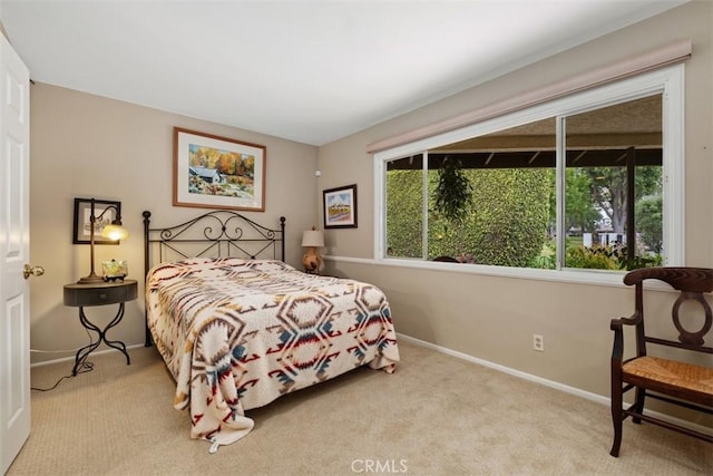 carpeted bedroom with baseboards