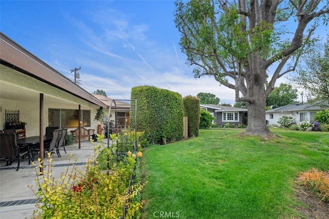 14321 Mimosa Ln, Tustin, CA 92780 - view of grassy yard with a patio