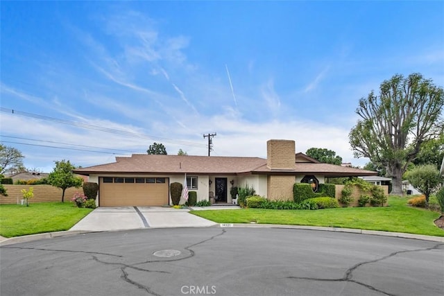 14321 Mimosa Ln, Tustin, CA 92780 - ranch-style house with concrete driveway, an attached garage, and a chimney