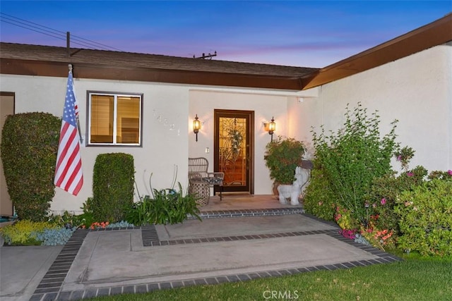 14321 Mimosa Ln, Tustin, CA 92780 - view of exterior entry featuring stucco siding