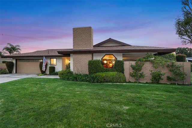 14321 Mimosa Ln, Tustin, CA 92780 - mid-century modern home featuring a chimney, driveway, a garage, and a lawn