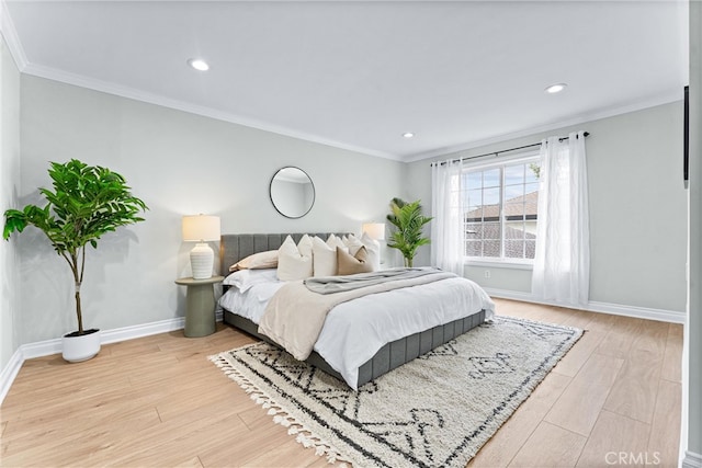 bedroom with baseboards, light wood-type flooring, ornamental molding, and recessed lighting