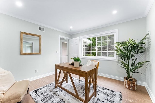 office area featuring baseboards, light wood-style floors, ornamental molding, and recessed lighting