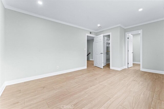 1972 N Fern St, Orange, CA 92867 - unfurnished bedroom featuring recessed lighting, baseboards, light wood finished floors, a spacious closet, and ornamental molding