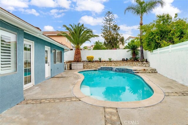 view of pool featuring a fenced backyard and a patio area