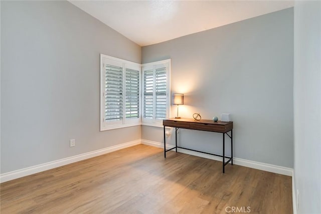 6199 Cabernet Pl, Rancho Cucamonga, CA 91737 - office space with baseboards, wood finished floors, and vaulted ceiling