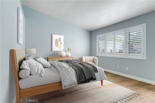 6199 Cabernet Pl, Rancho Cucamonga, CA 91737 - bedroom with baseboards, wood finished floors, and lofted ceiling