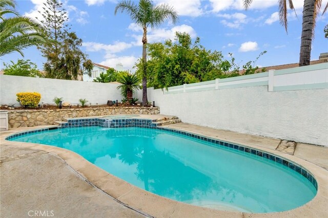 view of swimming pool with a fenced backyard