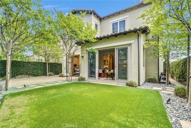135 Bridle Path, Irvine, CA 92602 - rear view of property with stucco siding and a patio area