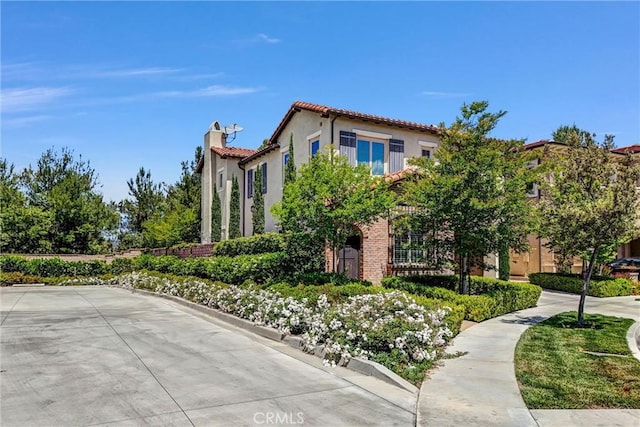 135 Bridle Path, Irvine, CA 92602 - view of home's exterior with a tiled roof and stucco siding