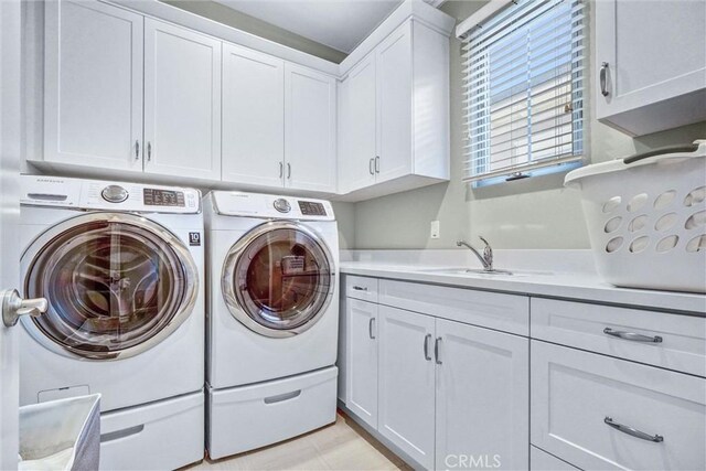 135 Bridle Path, Irvine, CA 92602 - washroom featuring cabinet space and separate washer and dryer