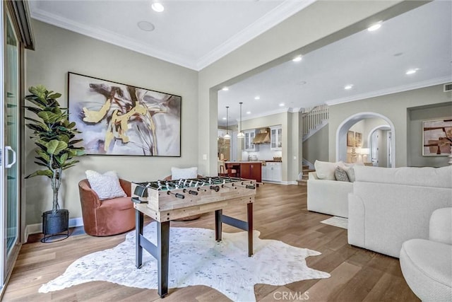 135 Bridle Path, Irvine, CA 92602 - playroom featuring arched walkways, wood finished floors, ornamental molding, baseboards, and recessed lighting