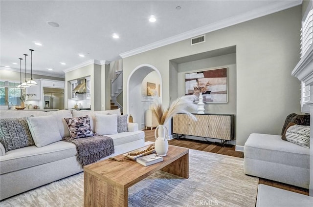 135 Bridle Path, Irvine, CA 92602 - living area featuring ornamental molding, wood finished floors, stairs, baseboards, and recessed lighting