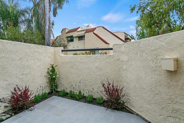view of patio / terrace featuring fence